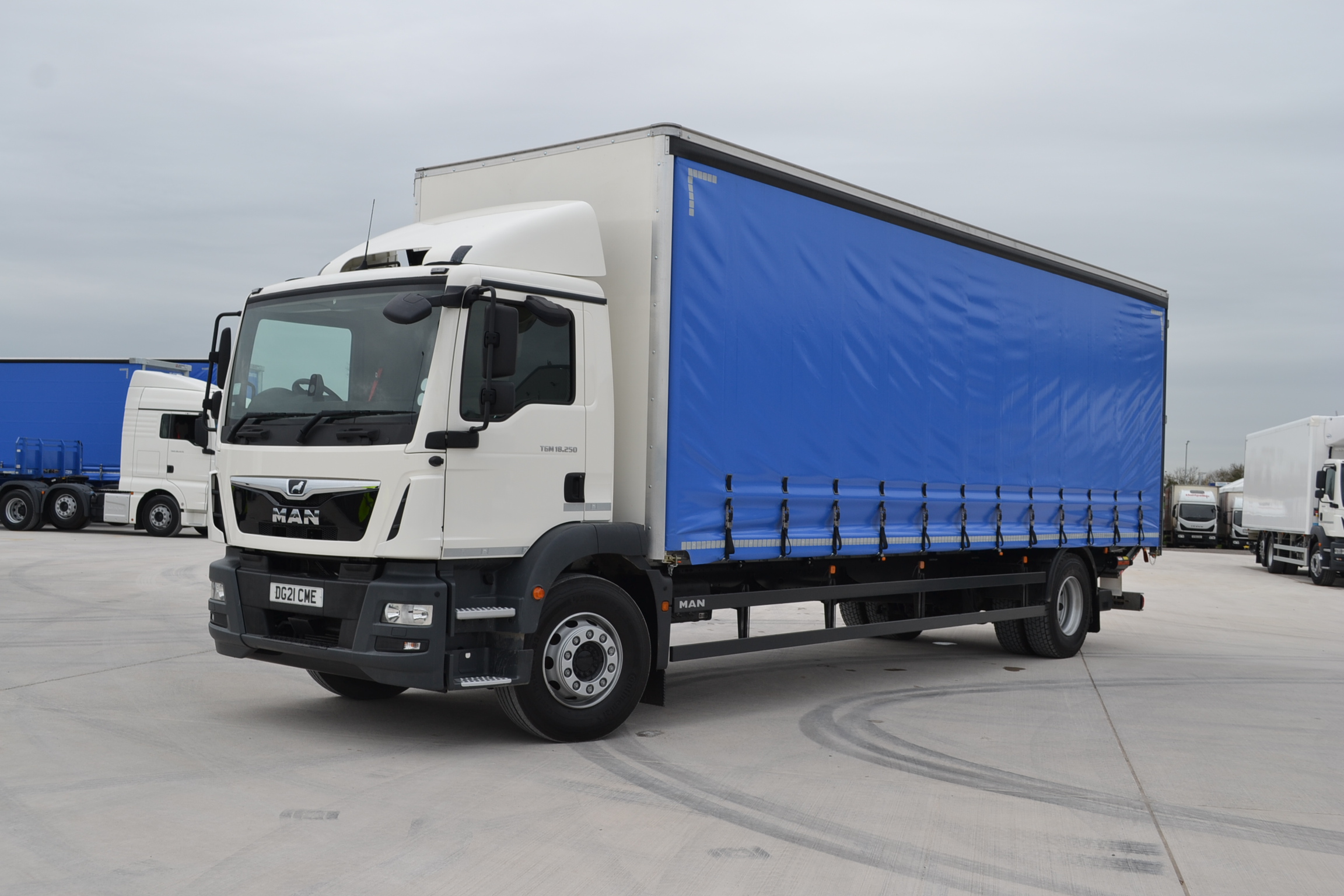 18t rigid curtainside with a white cab and blue curtains